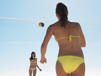Girls playing Volleyball at the beach